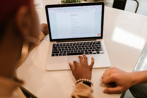 A woman filling out an online form